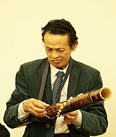 Madagascar. Valiha, modern with metal strings. The instrument's soundboard-surface has a modern finish.