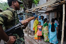 A Border Security Force soldier carrying an L1A1 rifle in West Bengal during elections, 2009.