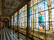 Stained glass windows along a hallway