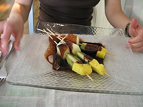 Fruit brochette with warm chocolate