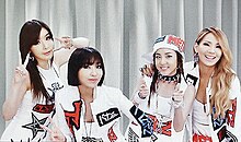 2NE1 onstage, in different poses