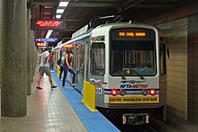 Passengers entering a subway train