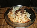 Image 13Bosnian ćevapi with onions in a somun. (from Culture of Bosnia and Herzegovina)