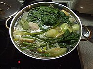 Chicken soup with dark, leafy greens