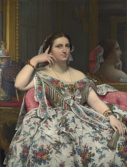 Madame Moitessier seated, wearing a cream white silk dress which is printed with floral patterns