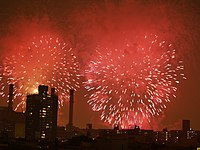 New York City's fireworks display, shown above over the East Village, is sponsored by Macy's and is the largest[34] in the country.