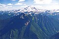 Painted Mountain (left of center, nearest to camera) with Glacier Peak centered at top. Southwest aspect as seen from Sloan Peak in 1999.