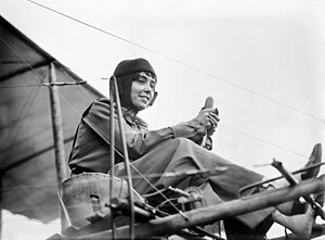Aviator Hélène Dutrieu seated in her airplane