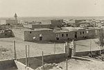 Historical photo of a fortress in a desert setting