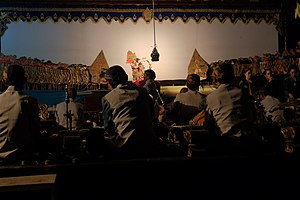 Dalang (Puppet master), Sindhen (traditional Javanese singer), and Wiyaga (Gamelan musicians) in Wayang Kulit Show in Java