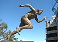 Shirley Strickland outside the Melbourne Cricket Ground. Sculptor: Louis Laumen