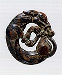 Harness ornament in the shape of a coiled wolf, characteristic of nomadic artifacts of southern Ningxia and southeastern Gansu, 5th-4th century BC.[106][103]