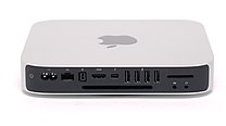 Back panel of a 2012, 6,1 model unibody Mac Mini. From left to right power button, AC power supply plug, Gigabit Ethernet, FireWire 800, HDMI, Thunderbolt/Mini-DisplayPort, USB 3.0 ports, SDXC card slot, audio in, audio out