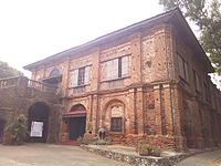 The Northern Luzon variant's most common feature is brick up to the second floor facade, in contrast with the common wooden second floor facade in other provinces. This particular building is the convent of Sarrat Church in Ilocos Norte