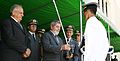 President Lula da Silva and the Minister of Defence Nelson Jobim delivering a sword during a graduation.