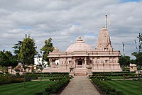Jain Temple at the Oshwal Centre, Potters Bar, Hertfordshire, which "recreates a general Māru-Gurjara aesthetic".[38] Side view.