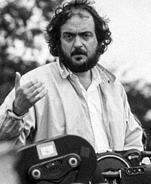 A black and white photograph of a bearded Kubrick