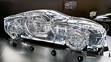 Translucent glass model in the shape of a coupe.