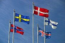 The flags of Denmark, Iceland, Finland, Sweden, and Norway flying on flagpoles