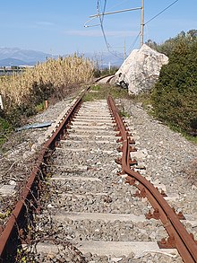 The boulder and the damaged line to the rail road