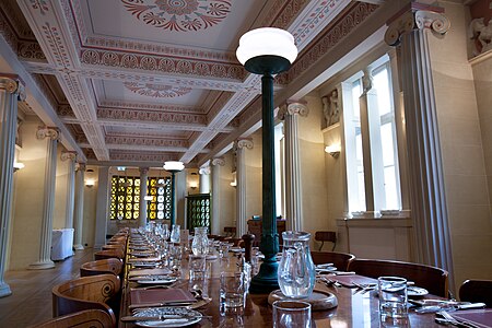 New Classical Greek Revival Ionic columns in the Gonville and Caius College Hall, Cambridge, UK, inspired by those from the Temple of Apollo at Bassaem by John Simpson, 1998