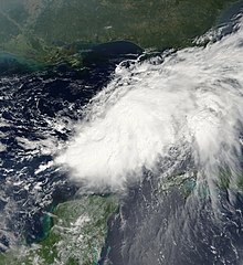 Satellite image of a large area of clouds over the Gulf of Mexico, elongated from upper-right to bottom-left.