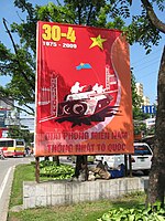 A sign in Hanoi, 2009, depicting the moment a Viet Cong tank crashed into the Presidential Palace on April 30, 1975.