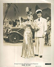 Miranda in a fruit hat and Don Ameche in uniform