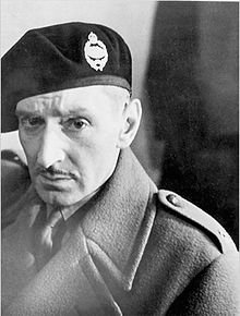 Black-and-white photograph of a man wearing military beret and uniform
