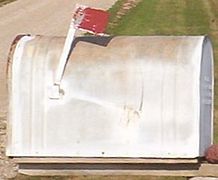 An oversize rural Joroleman mailbox in southern Nebraska, featuring a red semaphore arm