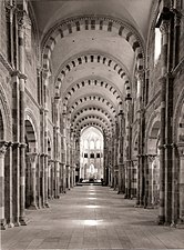 Nave of Vézelay Abbey, (1104–1132) with Romanesque groin vaults in the nave (foreground) and Gothic rib vaults in the choir (background)