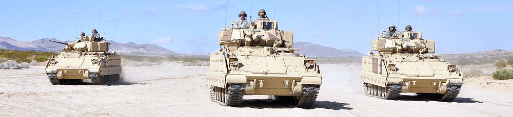 Soldiers of the 1st Battalion, 185th Armor (Combined Arms Battalion) maneuver in a "wedge formation" in Bradley Fighting Vehicles at Fort Irwin National Training Center, 2011