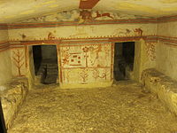 Tomb of the Bulls, back wall of main chamber. The main scene probably represents the ambush of Troilus