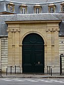 Two pairs of Ionic pilasters flanking a door in Paris