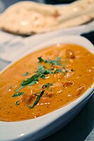 Chicken tikka masala, adapted from Indian chicken tikka and called "a true British national dish." The dish is now popular staple in Indian restaurants worldwide.[40]