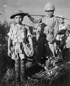 Chinese soldier, age 10, following the capture of Myitkyina airfield, Burma