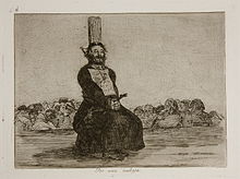 A bearded man in clerical vestments tied to a stake on a platform. He is squatting and his hands are bound. In the background is a large group of people, standing below the platform, with indistinct faces.