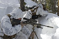 U.S. Marines wearing snow-patterned MARPAT overgarments at the Mountain Warfare Training Center