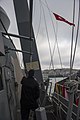 A courtesy Turkish flag is raised aboard the destroyer USS Truxtun as the ship transits the Bosphorus strait