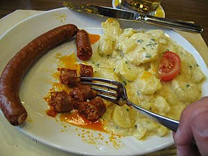 Swiss cuisine – paprika sausage with potatoes at the Zeughauskeller, Zürich, Switzerland