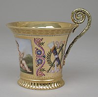 Empire style cup with silver handle from a breakfast service