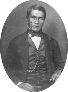 Hawaiian man in western Victorian formal suit