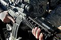 Close-up of M4 carbine with Picatinny rail mounted laser and with M68 Close Combat Optic.
