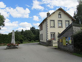 The town hall and war memorial in Lamazière-Haute