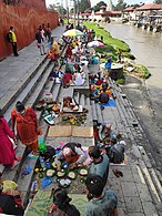 People performing shraddha on the banks of Bagmati river near Pashupatinath temple, Nepal