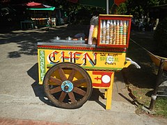 Traditional colorful wooden sorbetes pushcart in Rizal Park, Manila