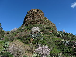 Babel mountain and blossoming almond trees