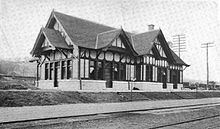A single-story Tudor Revival railroad station