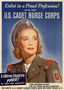 A model posing for a recruiting poster in the cadet winter uniform – gray with red shoulder straps – and a gray beret
