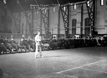 Gustave F. Touchard at the 1908 U.S. National Indoor Tennis Championships at the Seventh Regiment Armory's drill hall